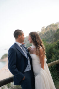 Bride and groom in loving gaze near lake Italian destination wedding