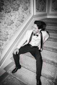 Stylish groom portrait at destination wedding in Italy