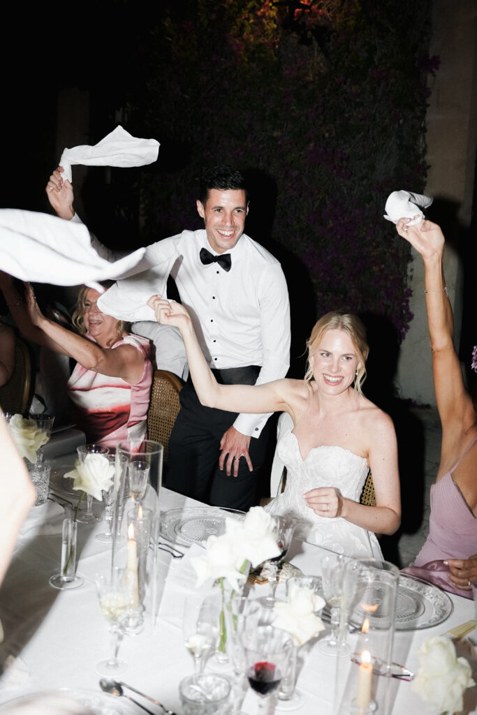 bride and groom celebrating at dinner finca son collell mallorca wedding photographer