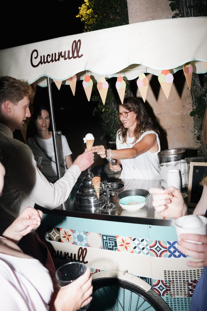 wedding guest enjoying ice cream cart at finca son collell mallorca