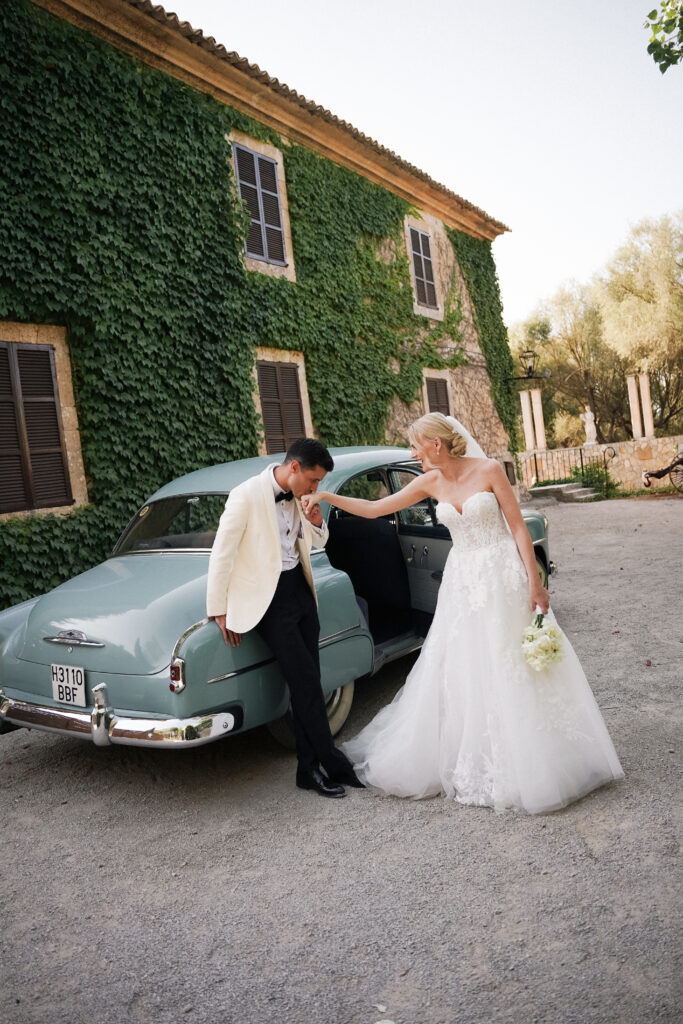 bride and groom with classic vintage car at finca son collell mallorca
