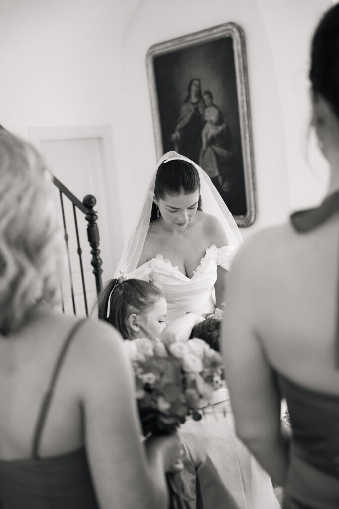 Bride in white dress walking down stairs at Cortijo Bravo